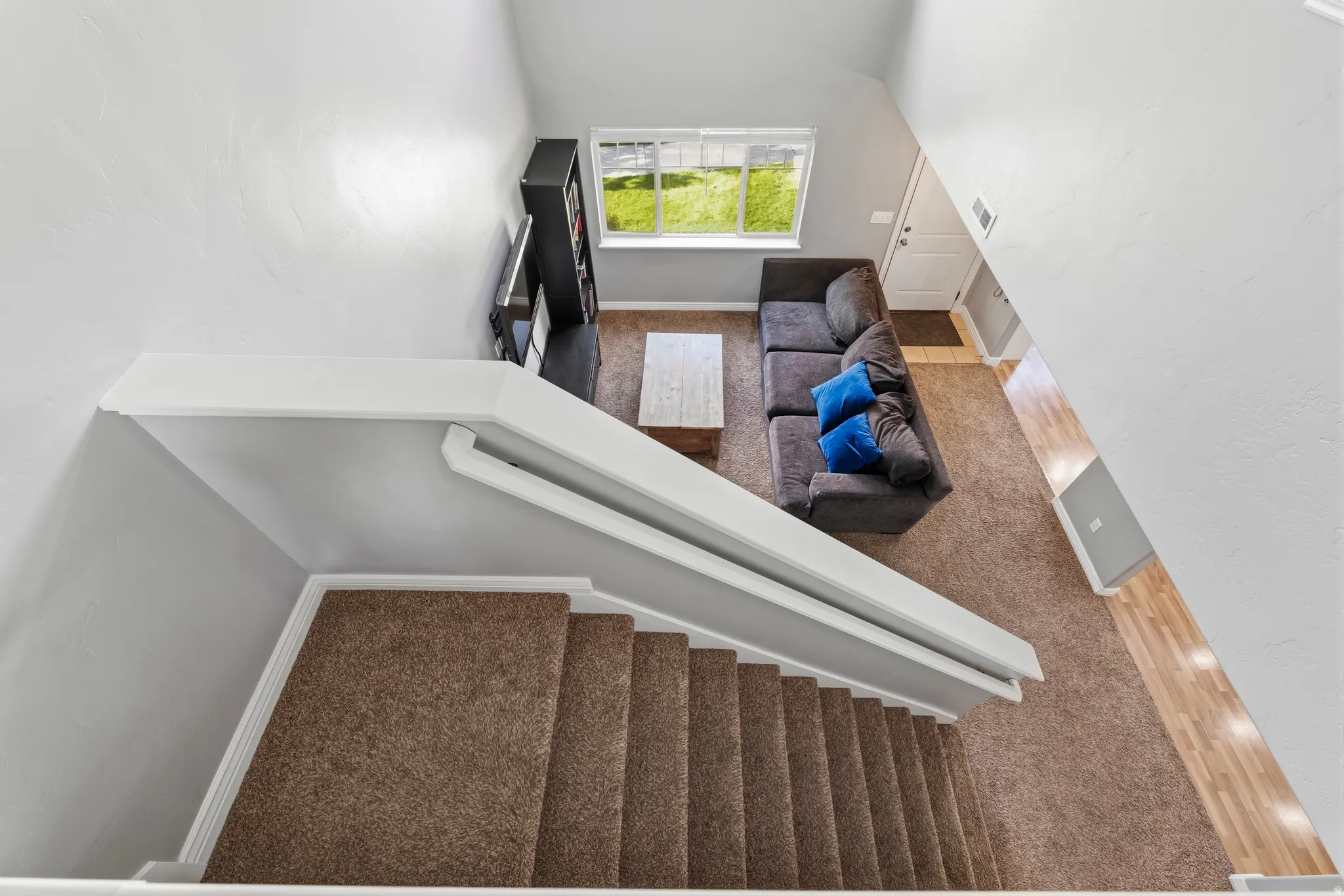 Staircase featuring carpet and baseboards