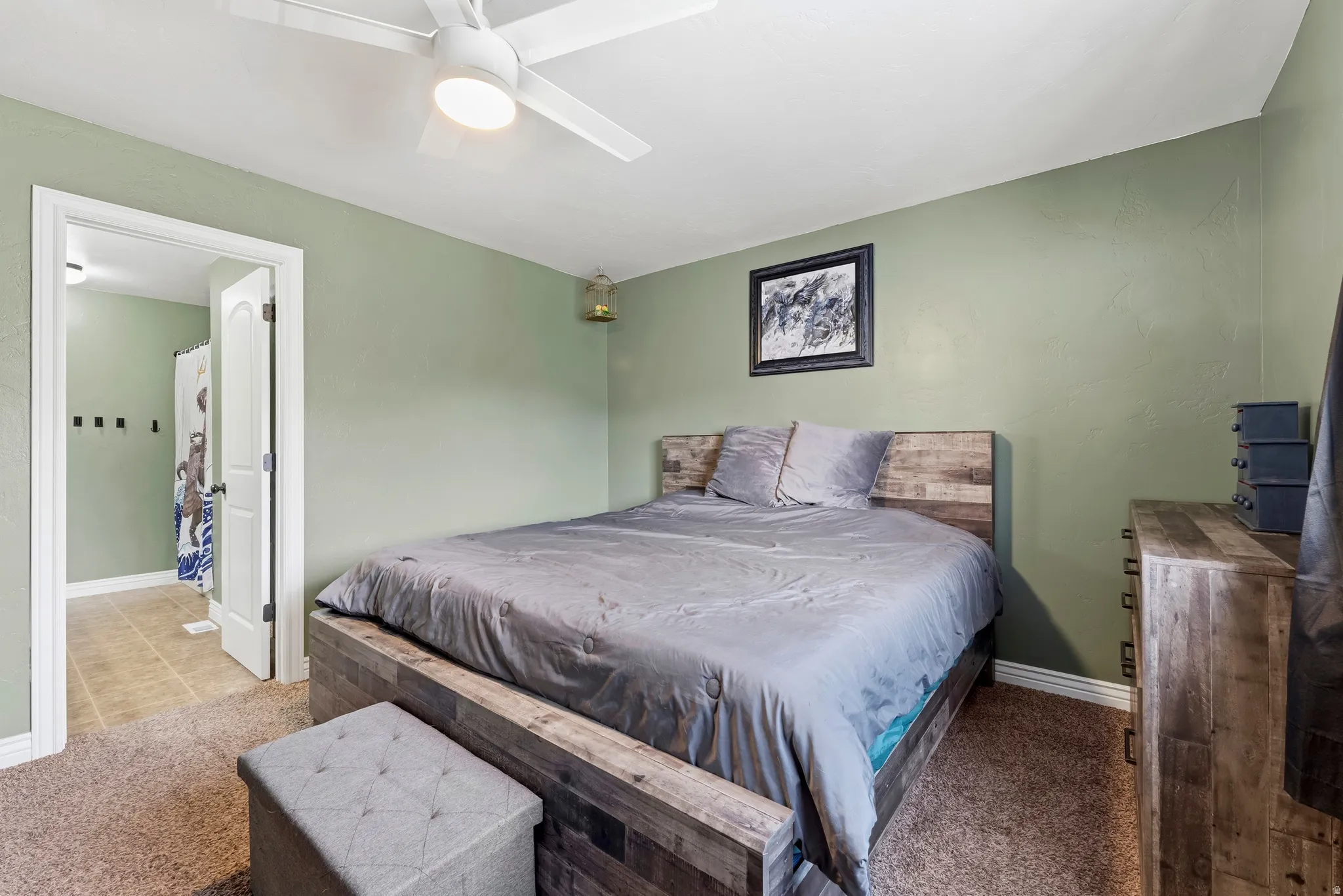 Bedroom featuring carpet flooring and a ceiling fan