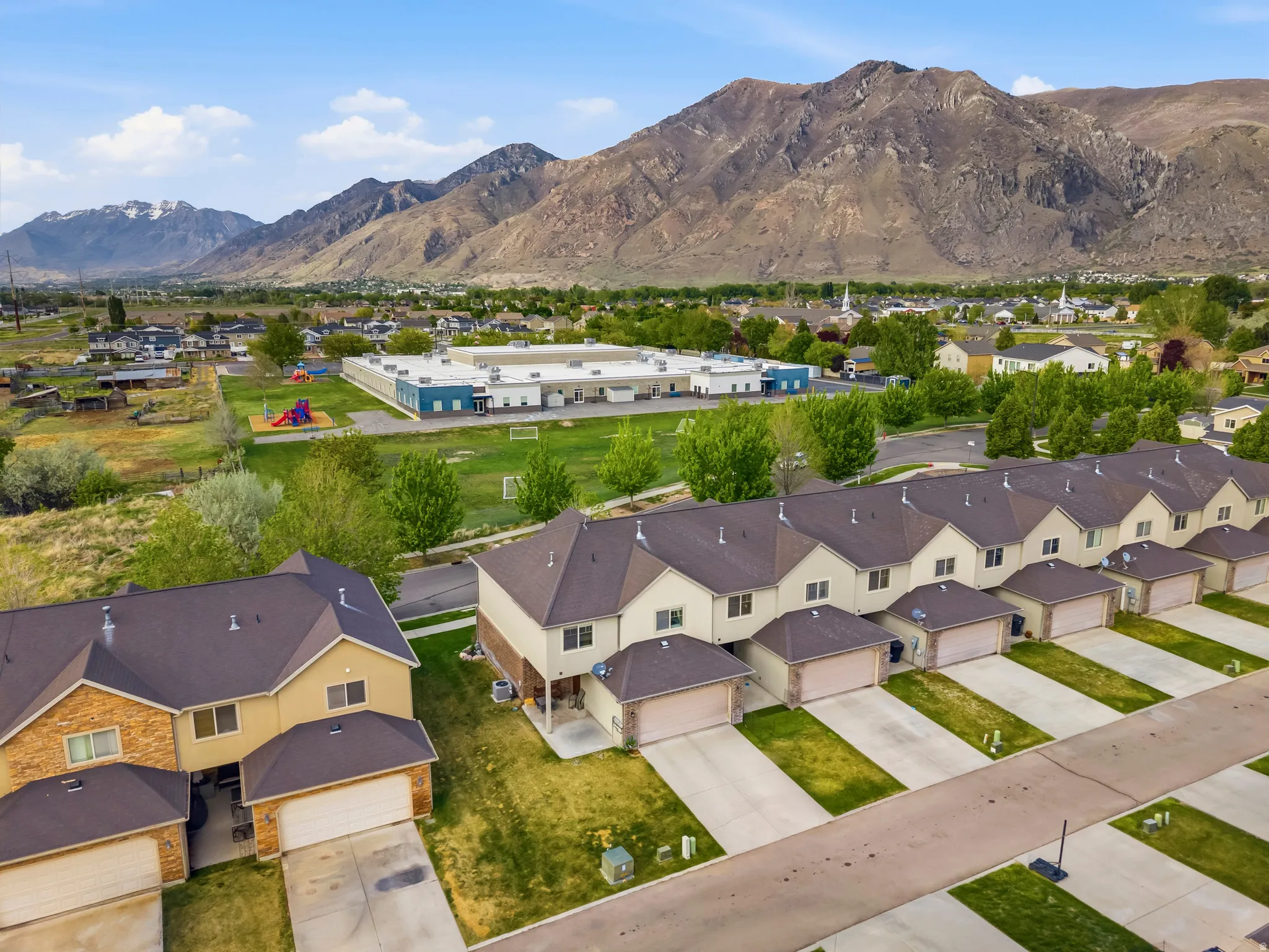 Aerial view of residential area with a mountainous background