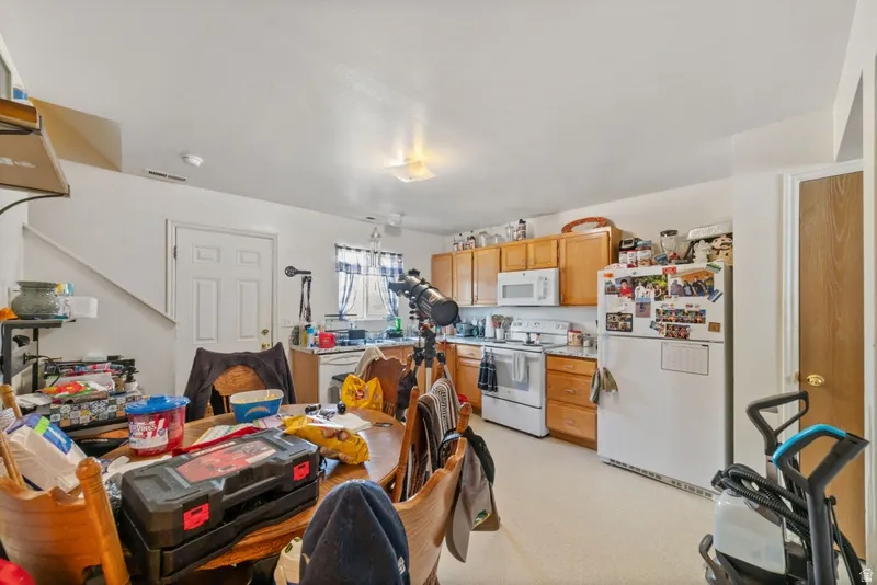 Kitchen with white appliances and light countertops