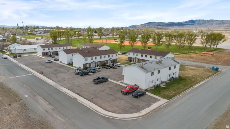 Drone / aerial view of mountains and a golf course