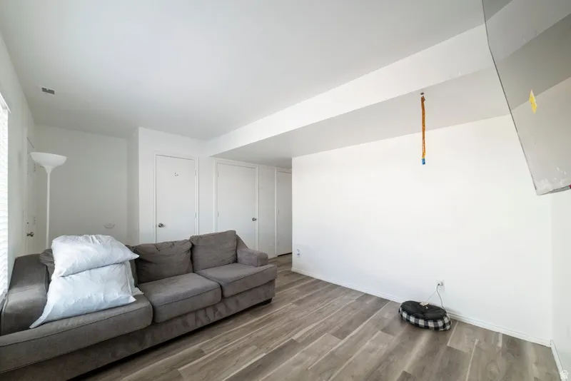 Living area featuring wood finished floors and baseboards