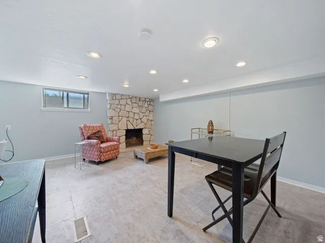 Family Room/Flex space  area with a gas fireplace and tile floors