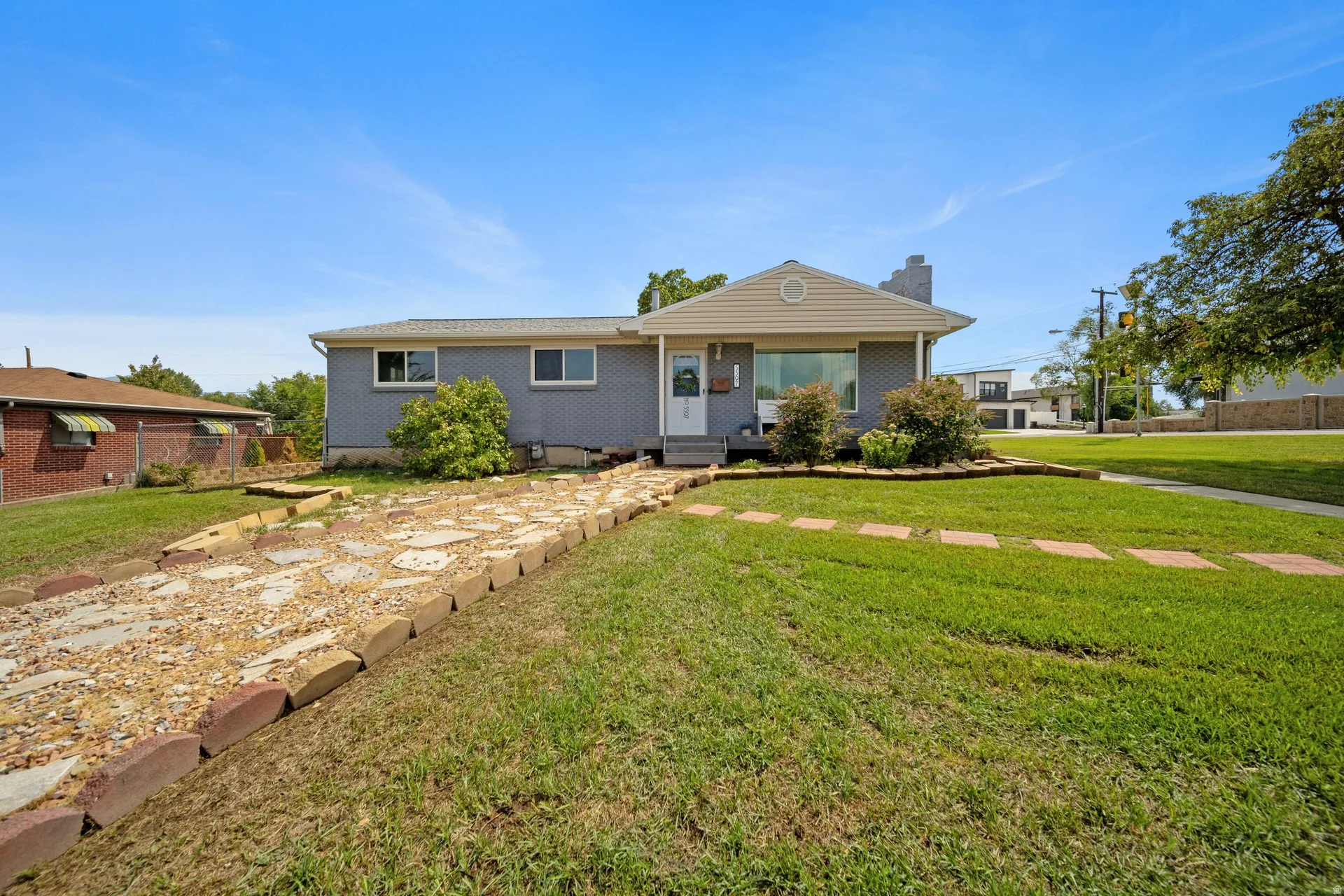 Ranch-style home featuring a large corner lot