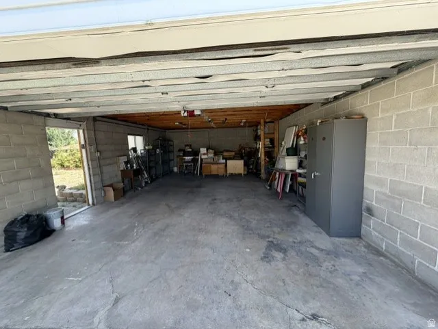 Extra deep garage with work bench. Tons of storage space.