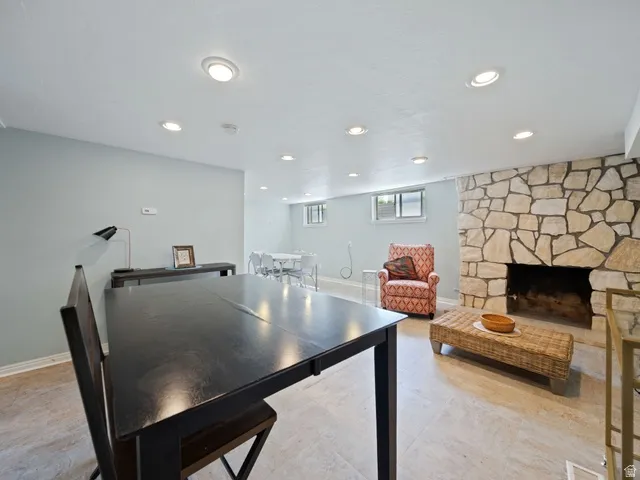 Family room with a fireplace and recessed lighting