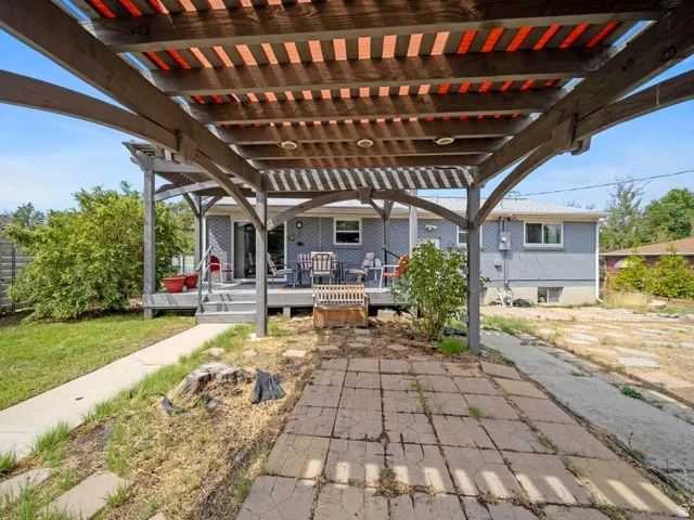 View of patio / terrace featuring a wooden deck and a pergola