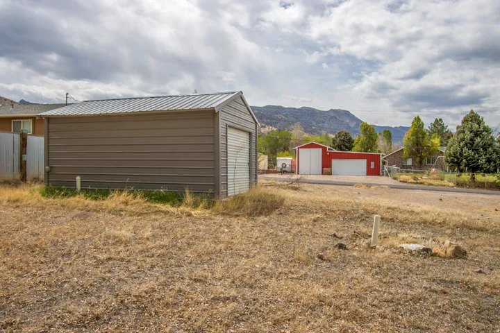 Detached garage featuring a mountain view