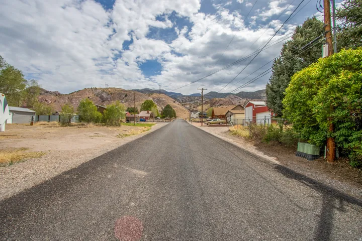 View of asphalt road with a mountain view and a residential view
