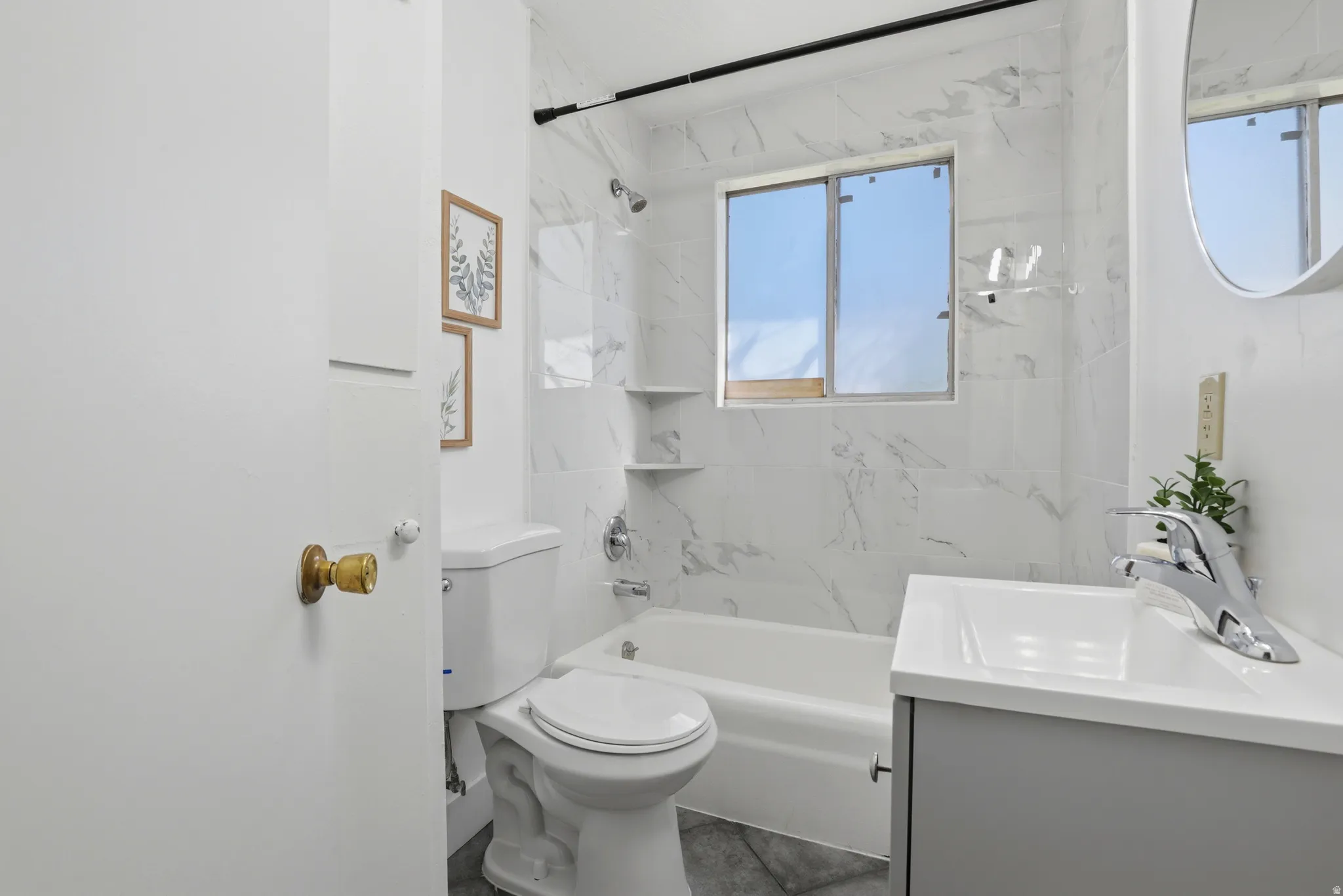 Bathroom with vanity and shower / bath combination