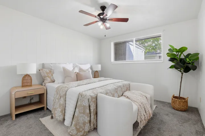 Bedroom featuring carpet and a ceiling fan