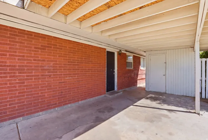 View of patio featuring a carport