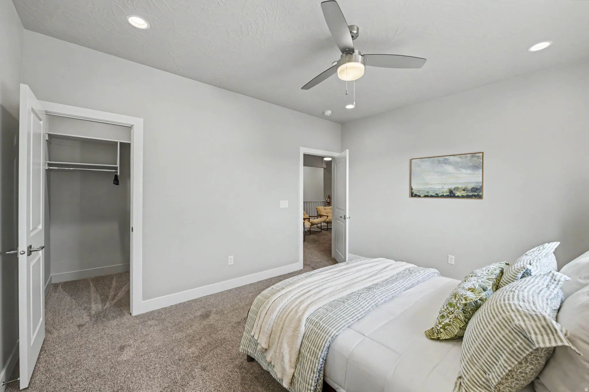 Plush carpet flooring, recessed lighting, and a modern ceiling fan