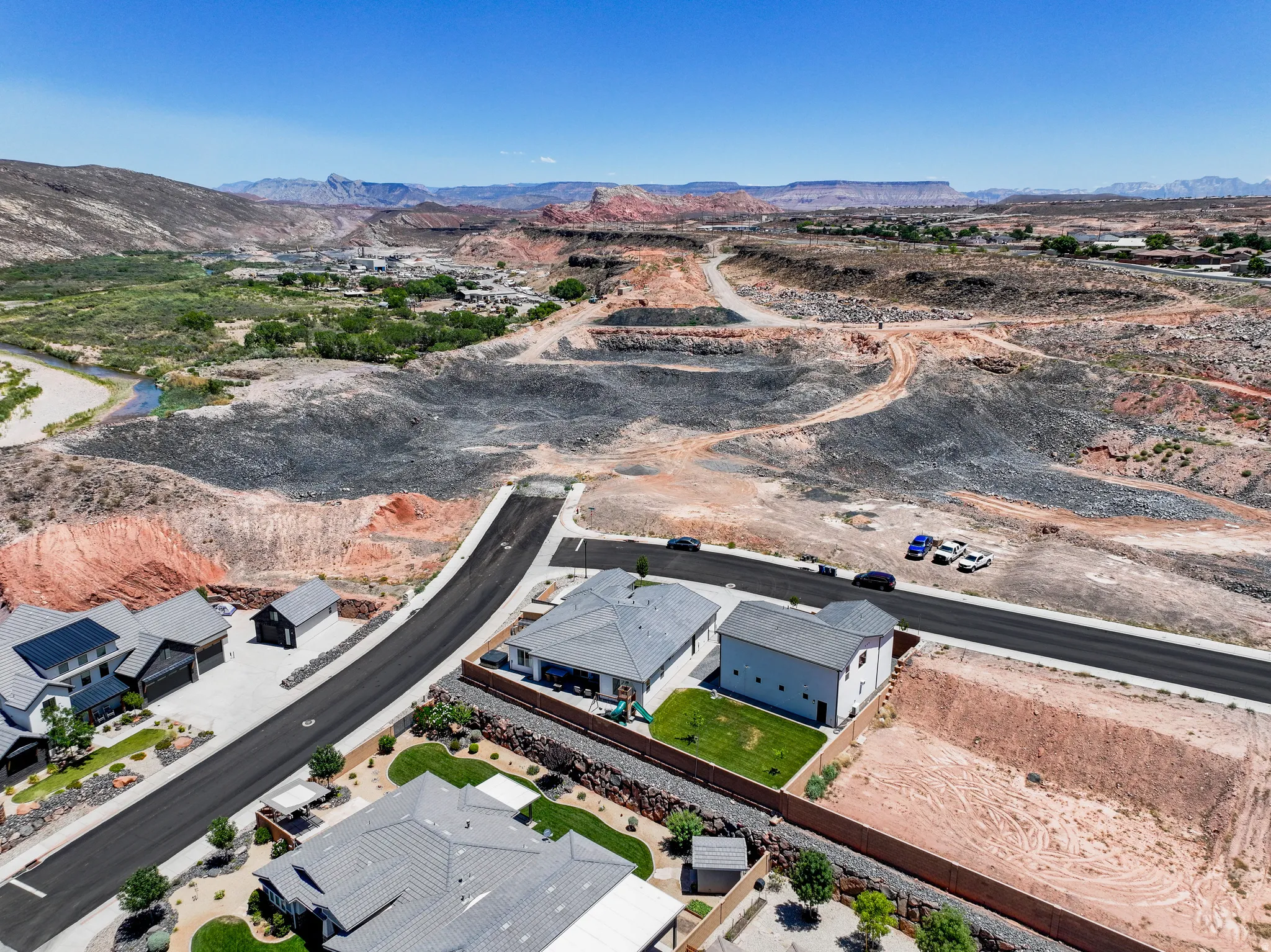 Aerial view of property's location featuring mountains and nearby suburban area