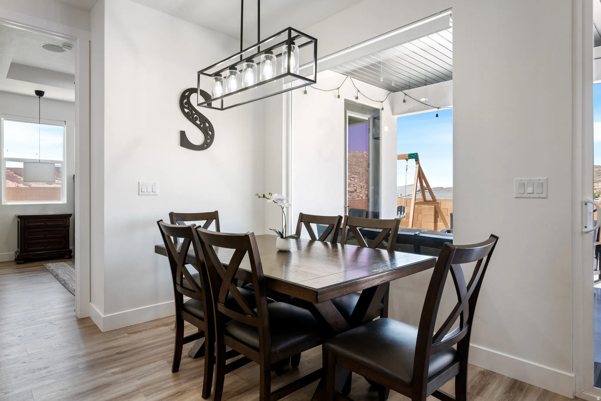 Dining room with light wood-style floors and baseboards