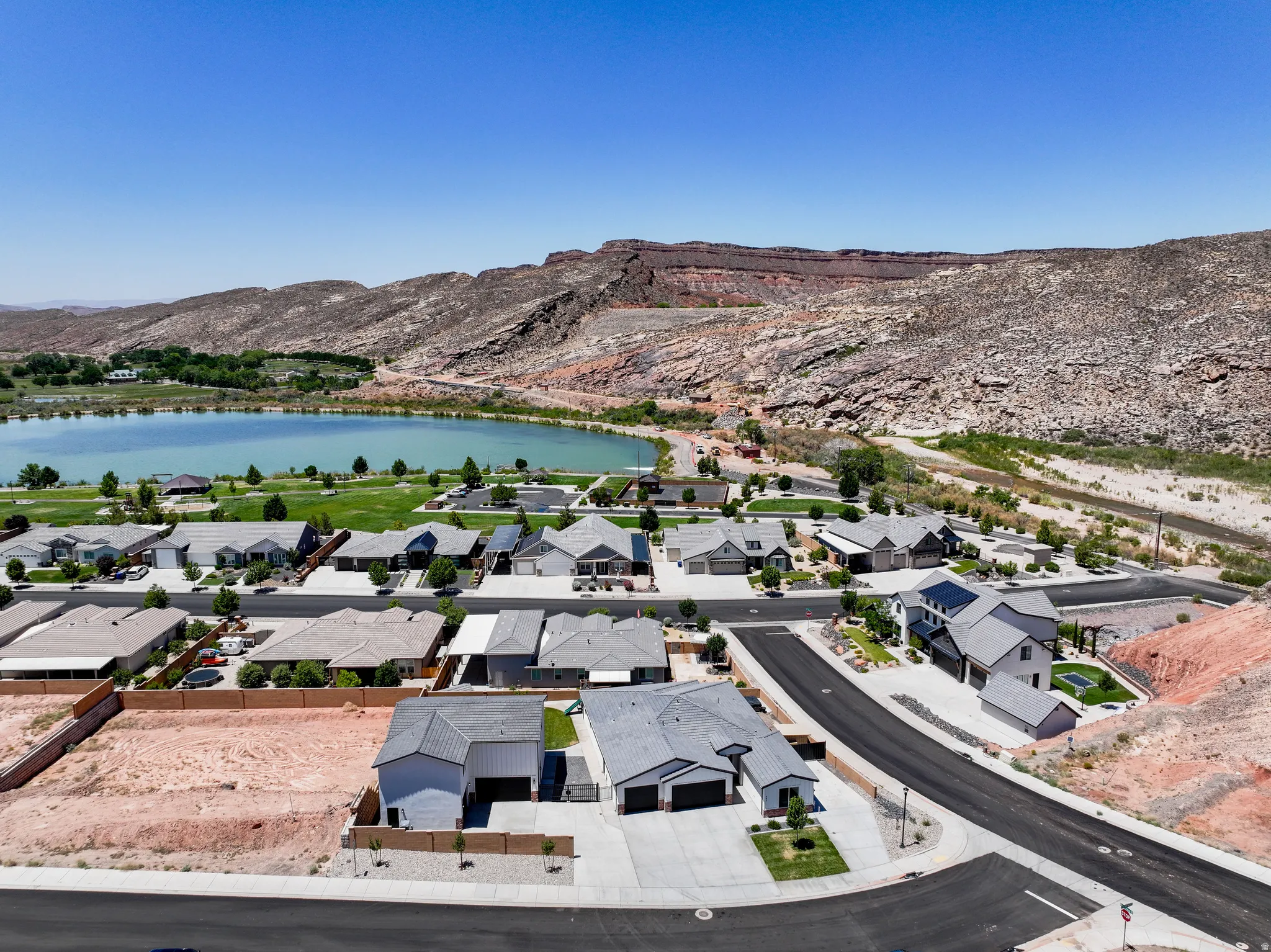 Aerial view of residential area featuring a water and mountain view
