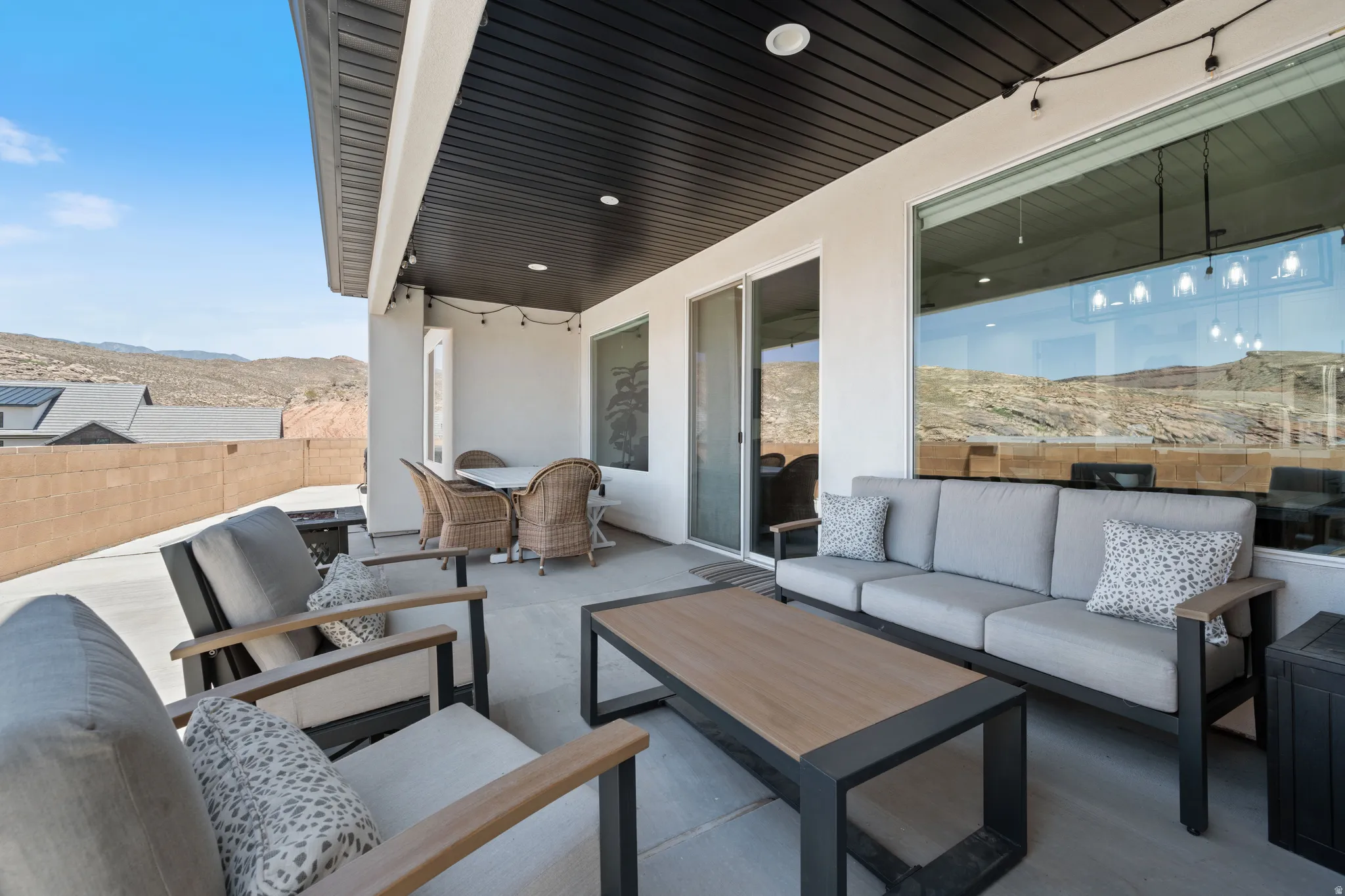 View of patio with an outdoor living space and a mountain view
