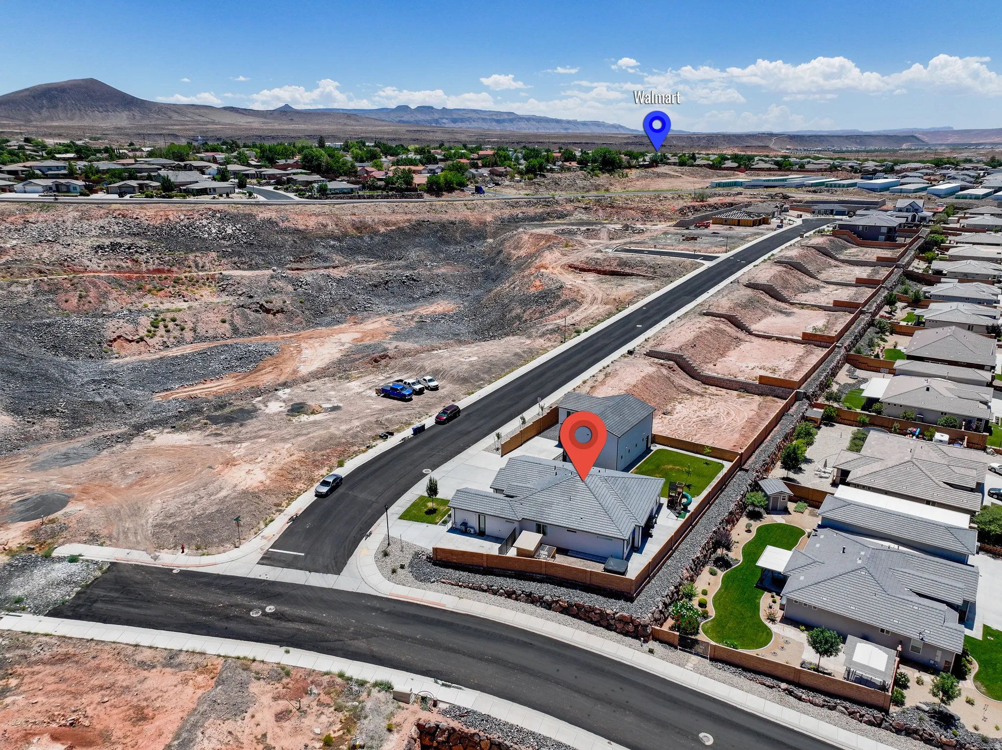View of property location featuring nearby suburban area and mountains