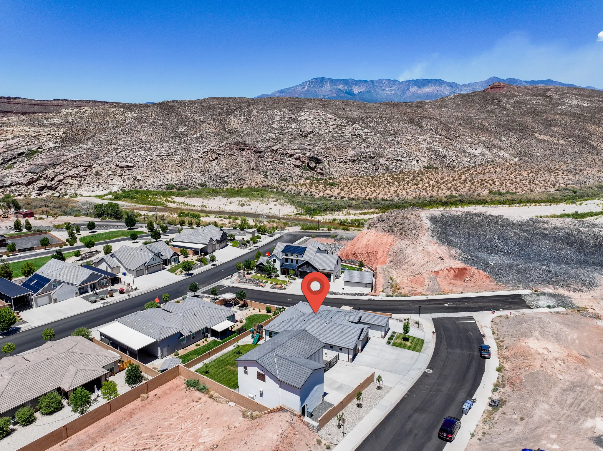 Aerial view of residential area with a mountain backdrop