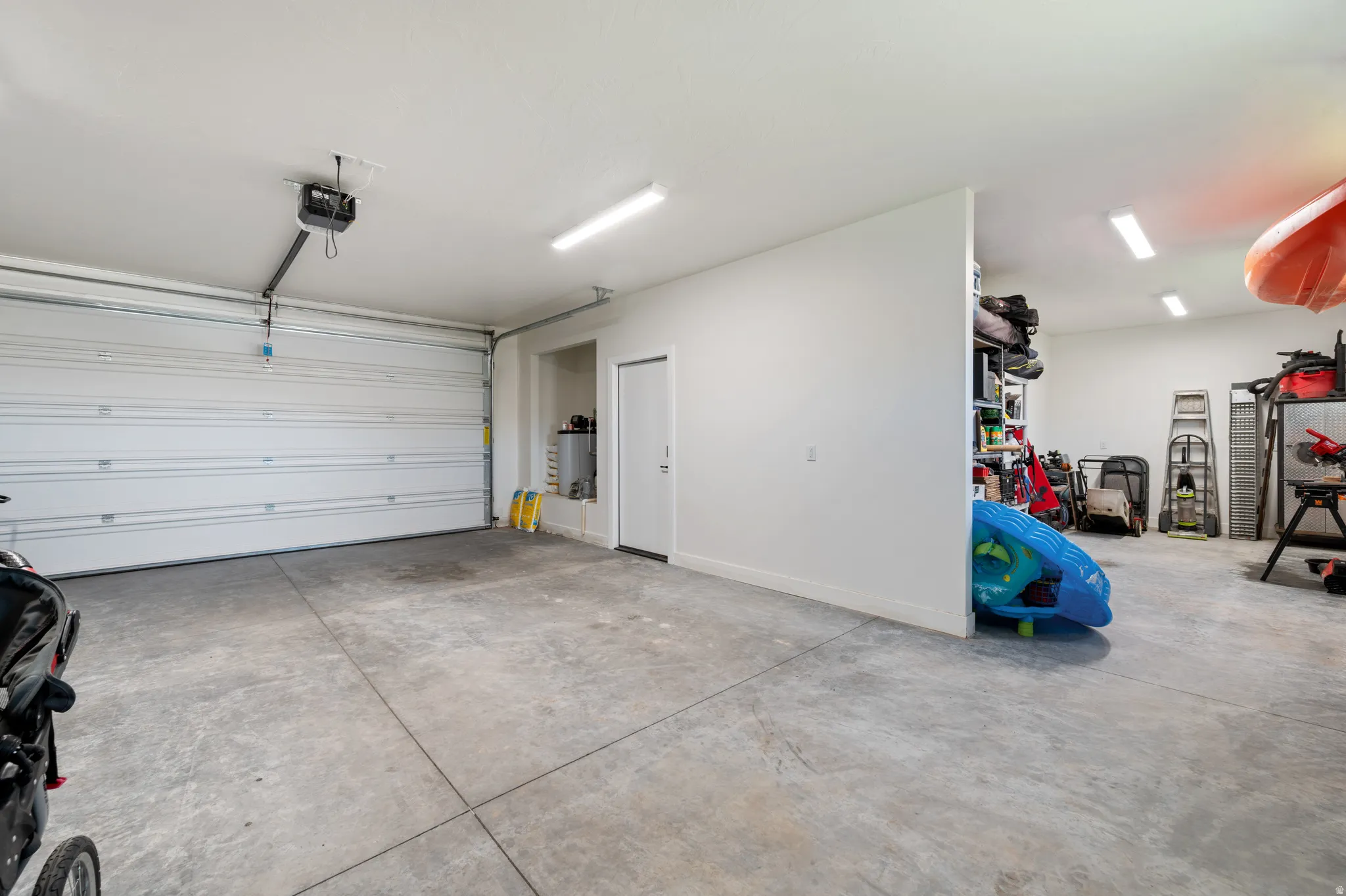 Garage featuring a garage door opener