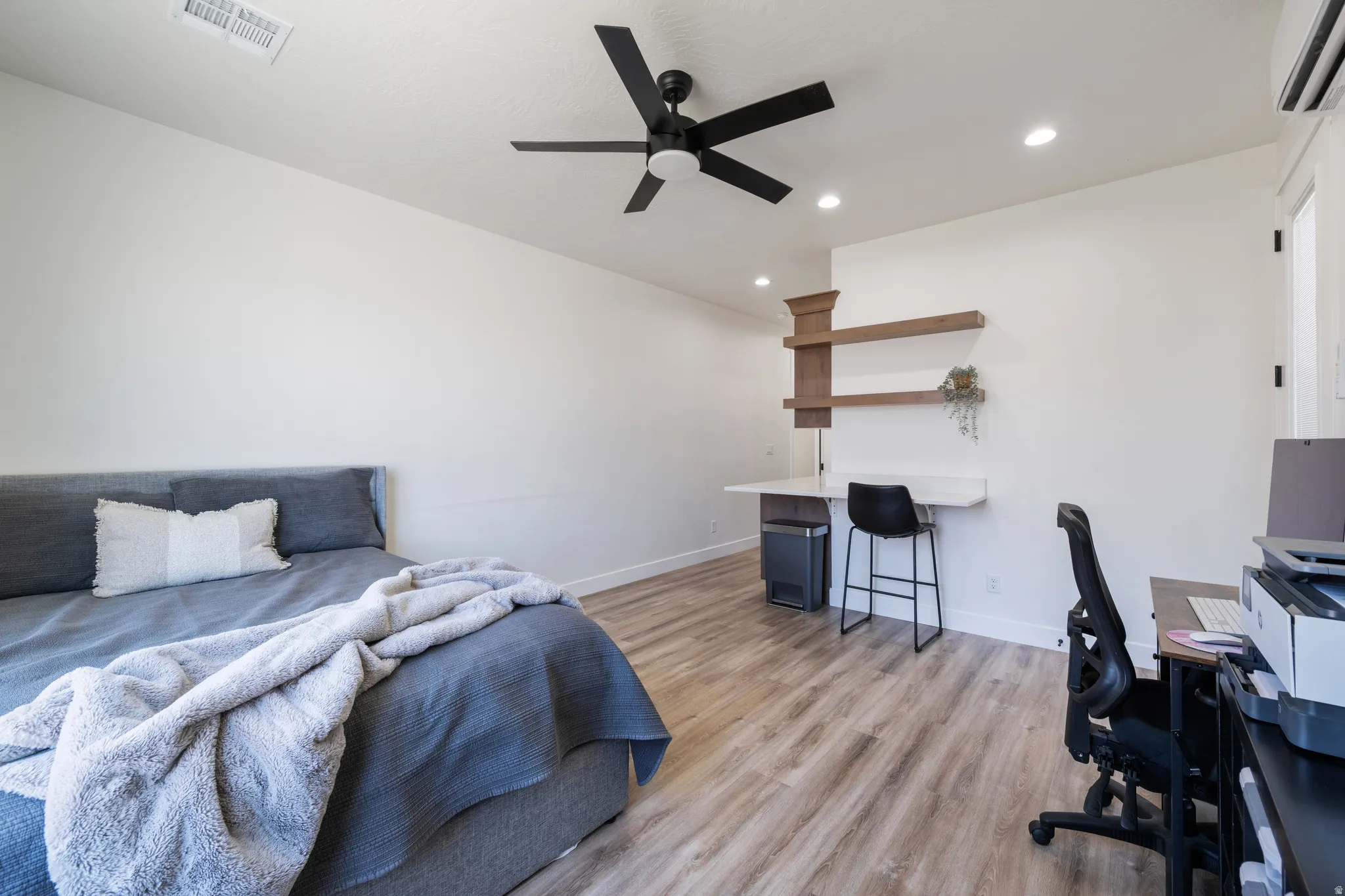 Bedroom with a desk, light wood finished floors, a ceiling fan, and recessed lighting