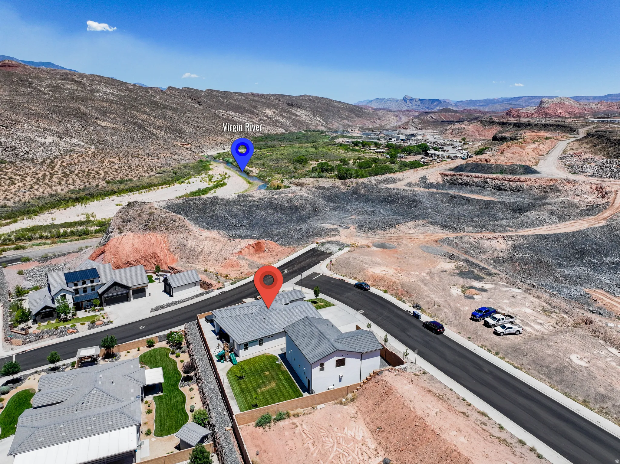 Aerial perspective of suburban area with a mountainous background