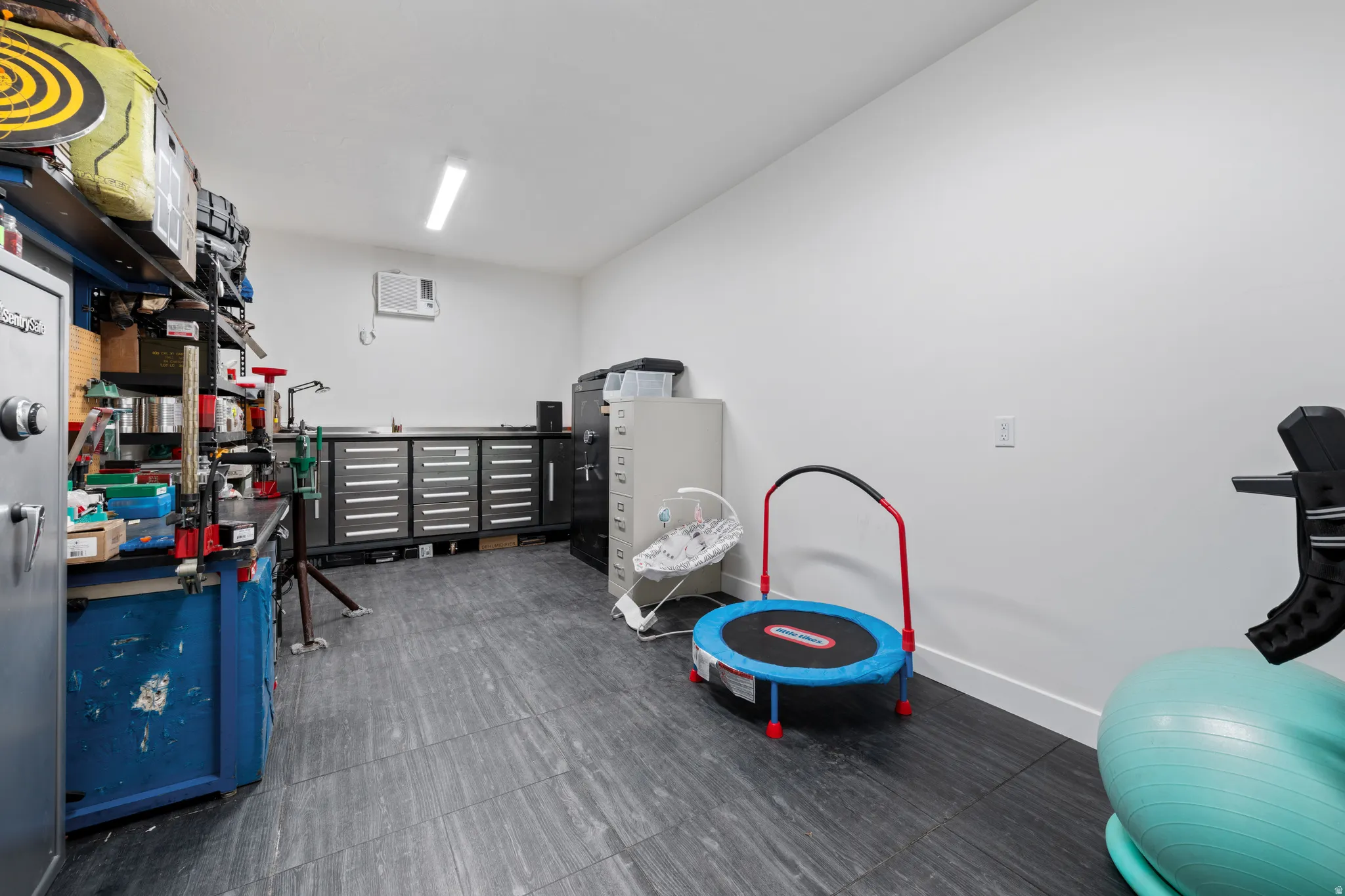 Storage area featuring a wall unit AC