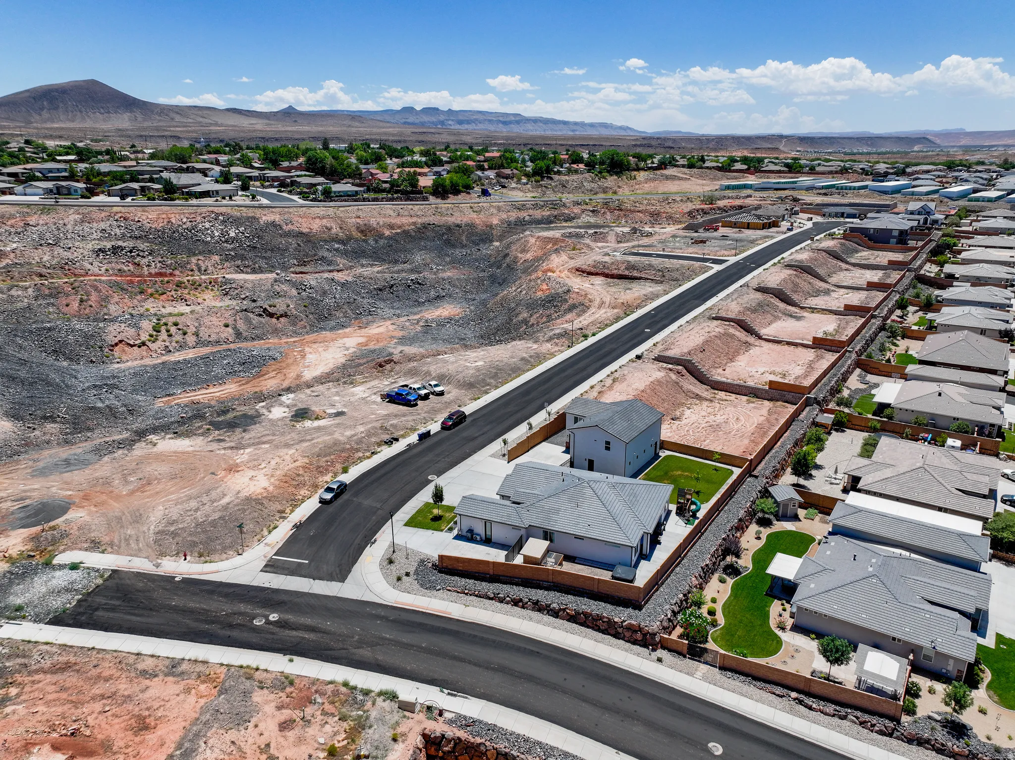 Aerial view of residential area with a mountainous background