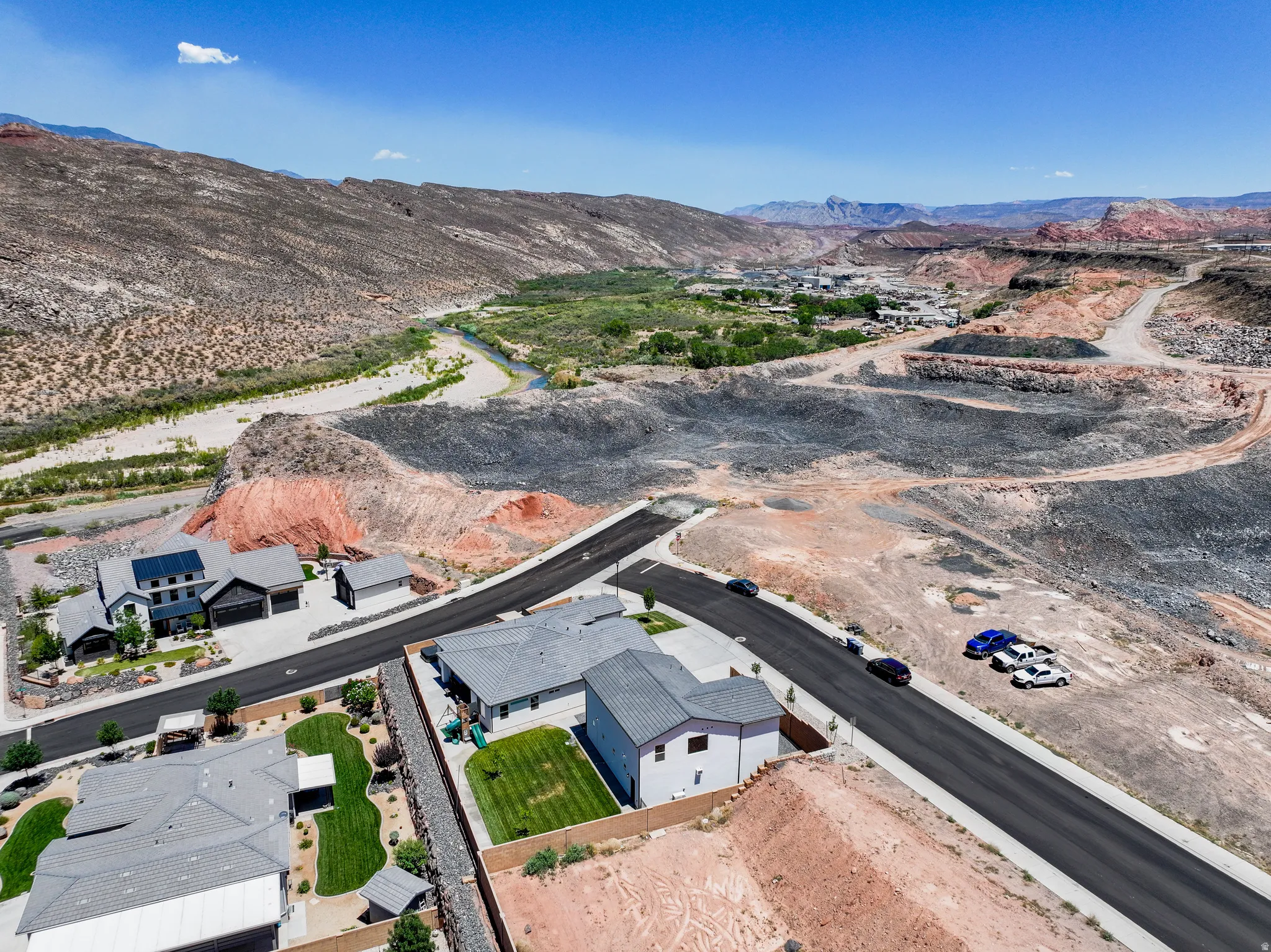 Aerial perspective of suburban area with a mountainous background