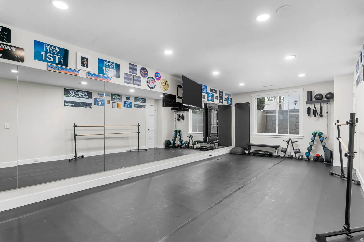 Workout room featuring recessed lighting and dark flooring