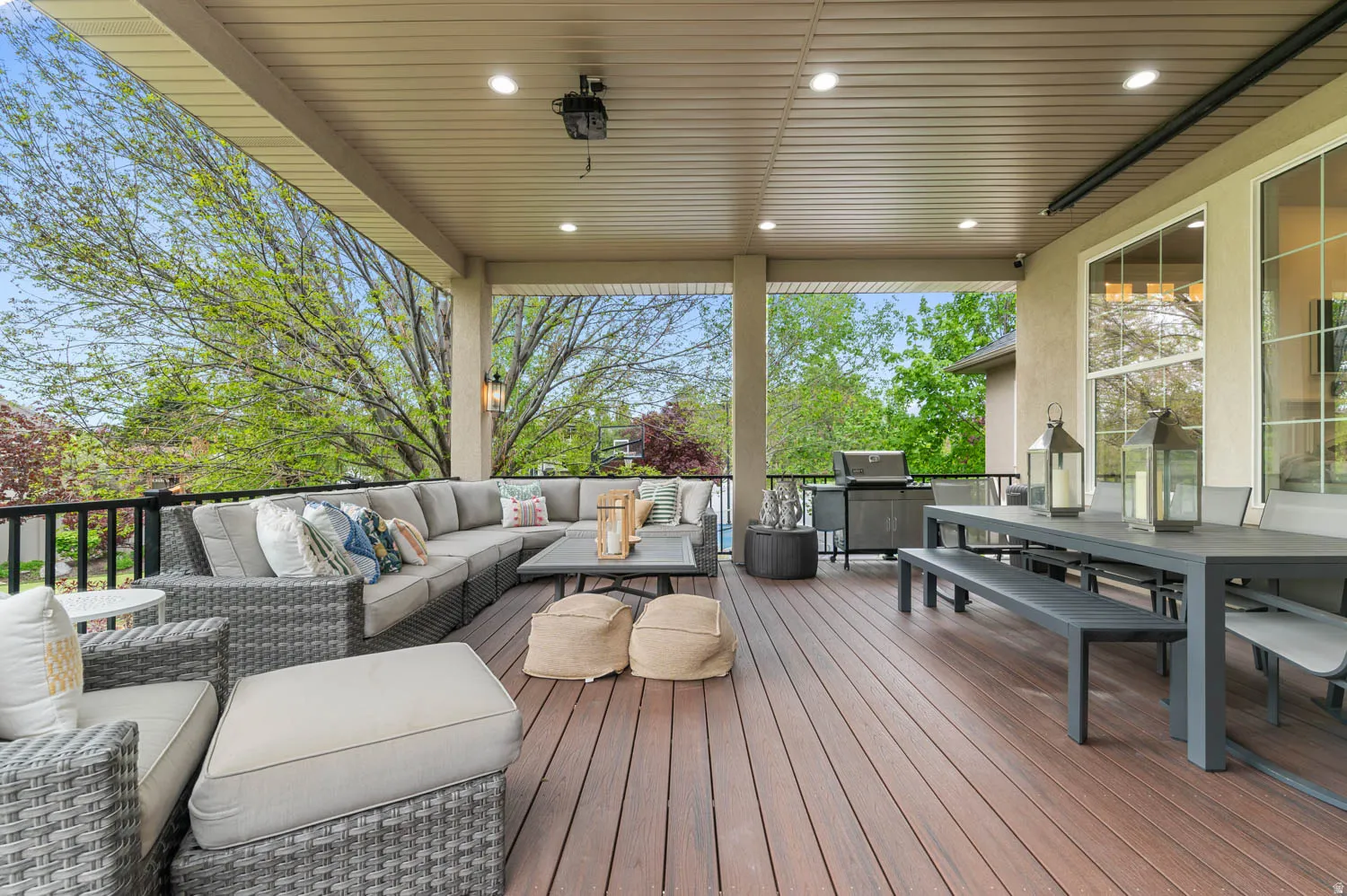 Wooden deck with an outdoor living / dining area