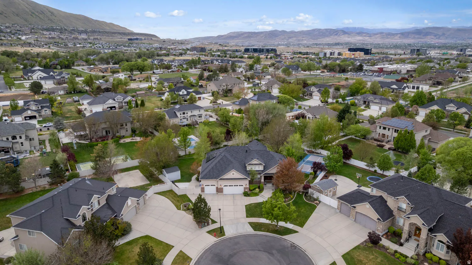 Aerial view of residential area featuring a mountainous background
