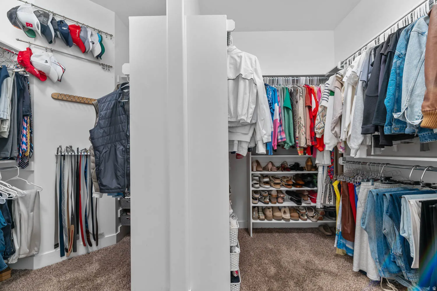 Walk in closet with carpet