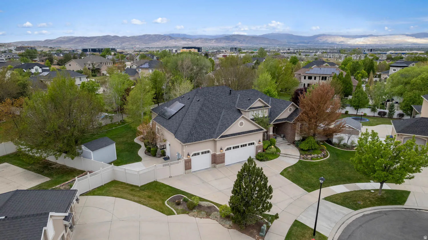 Aerial view of residential area featuring a mountainous background