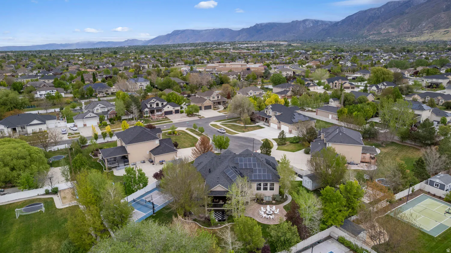 Aerial view of residential area featuring a mountain backdrop