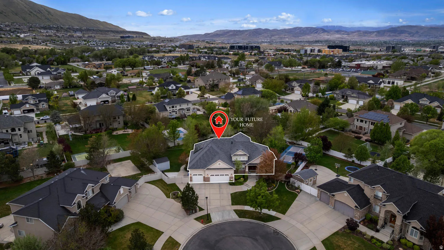 Aerial view of residential area featuring a mountain backdrop