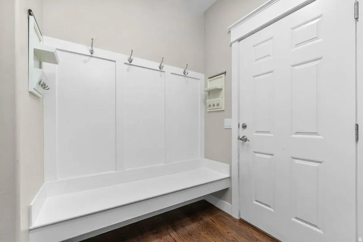 Mudroom featuring dark wood finished floors