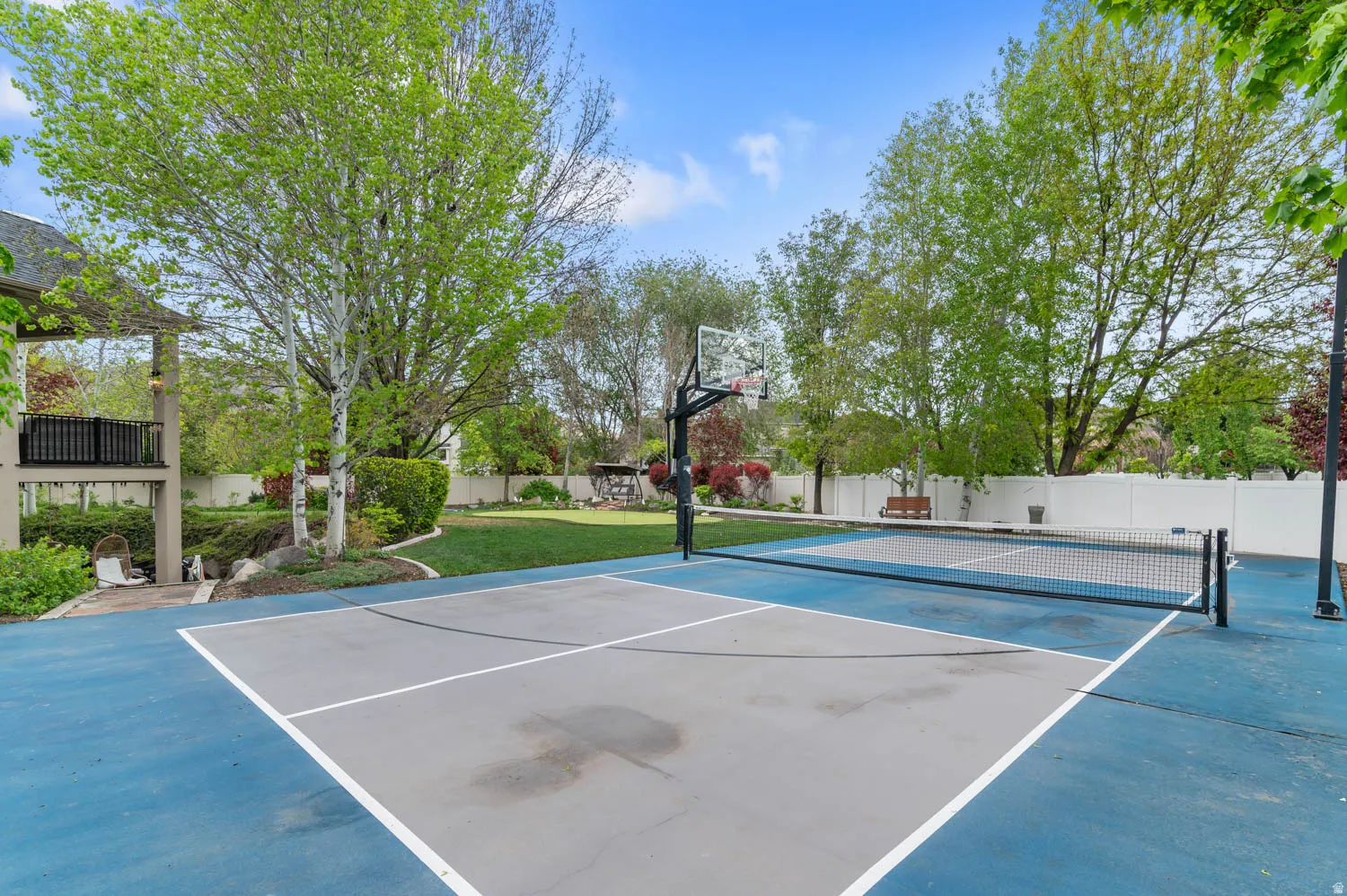 View of Pickleball court/basketball court, and a patio area