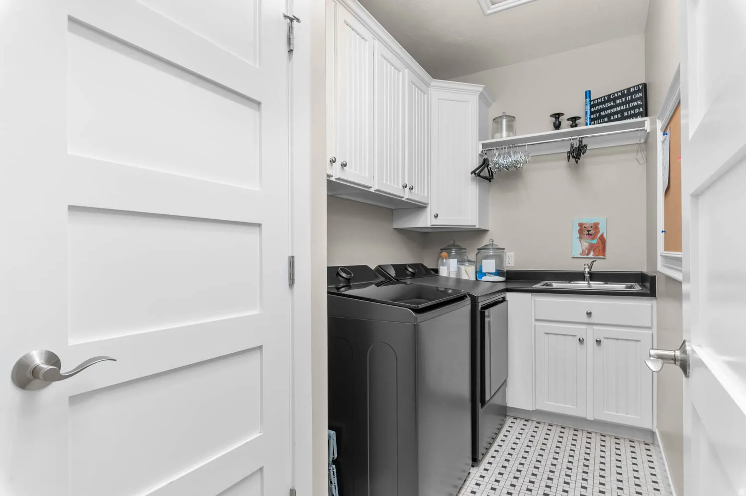 Laundry room featuring cabinet space, independent washer and dryer, and light flooring