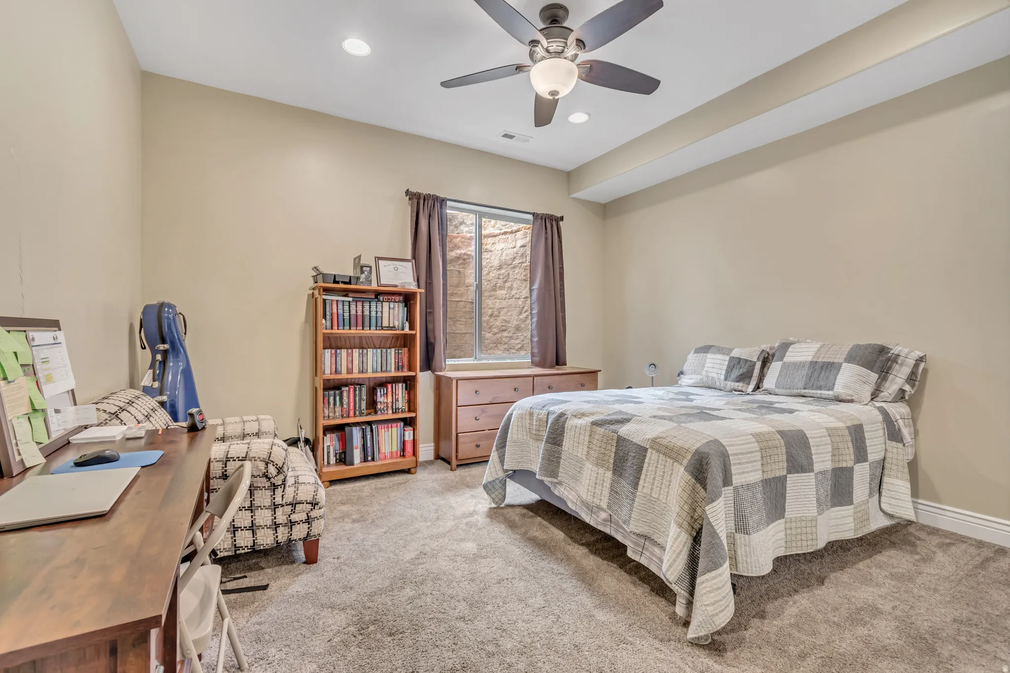 Bedroom with light colored carpet, a ceiling fan, and recessed lighting