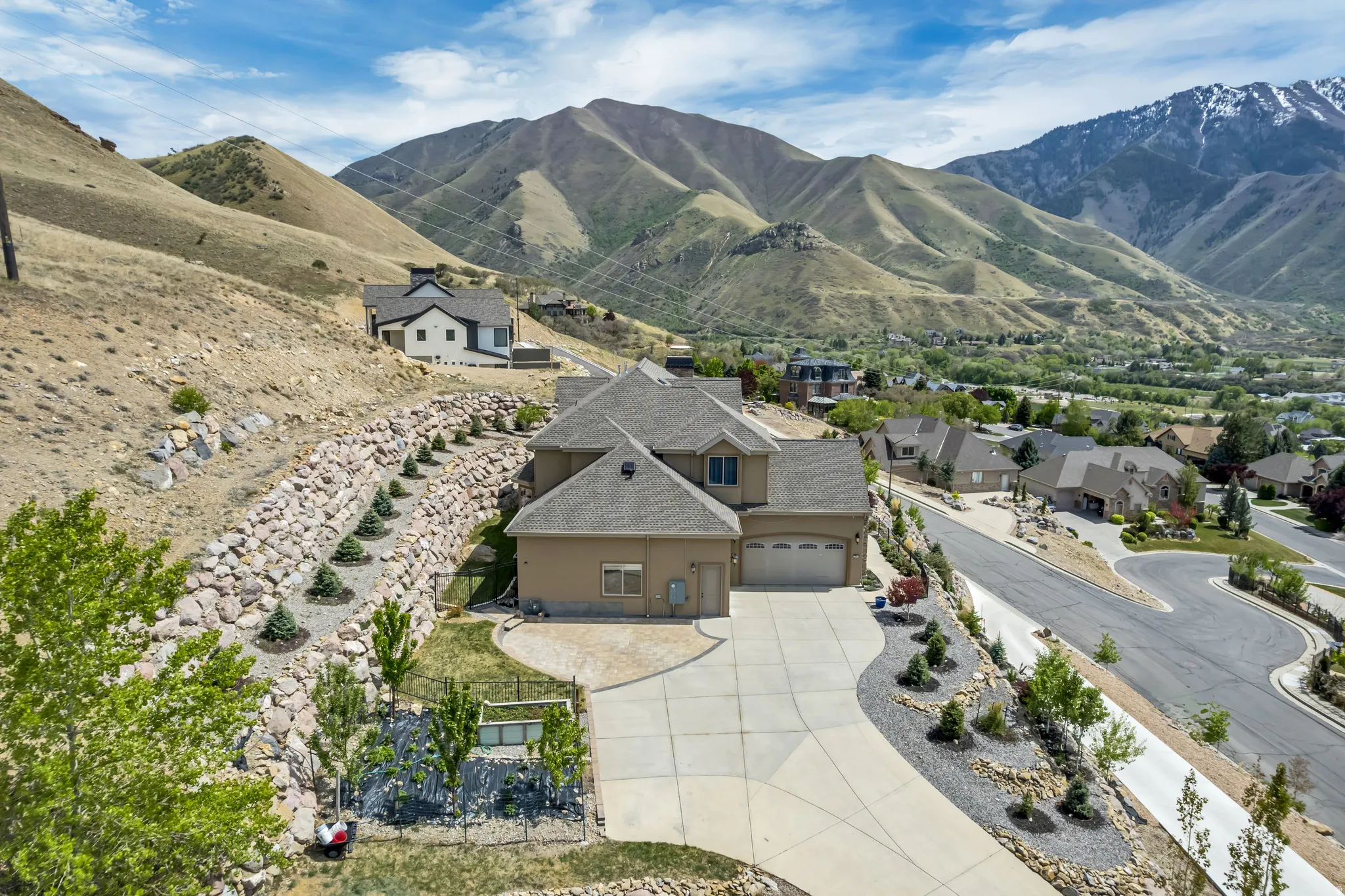 Aerial perspective of suburban area featuring a mountain backdrop