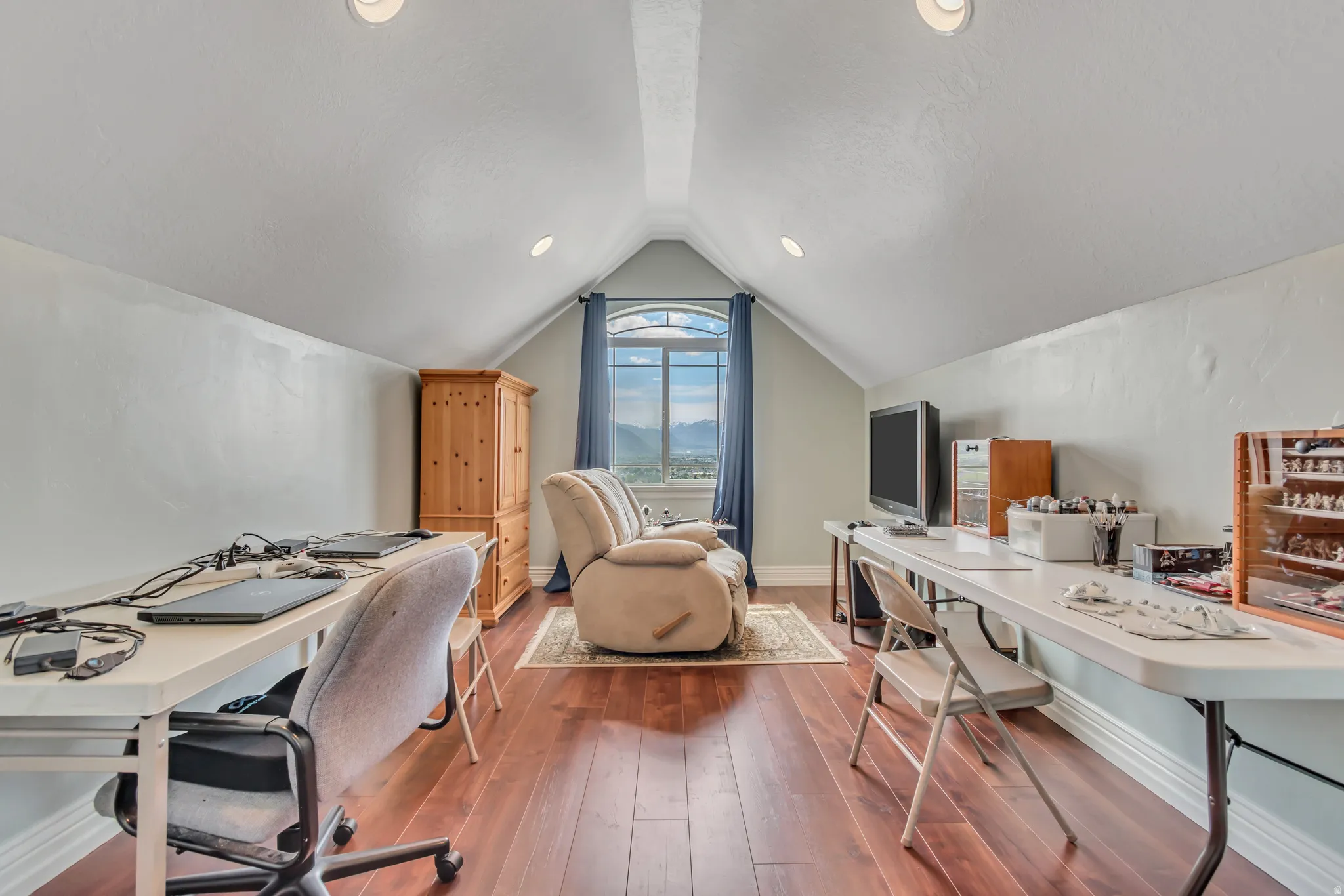 Home office featuring baseboards and dark wood-style floors