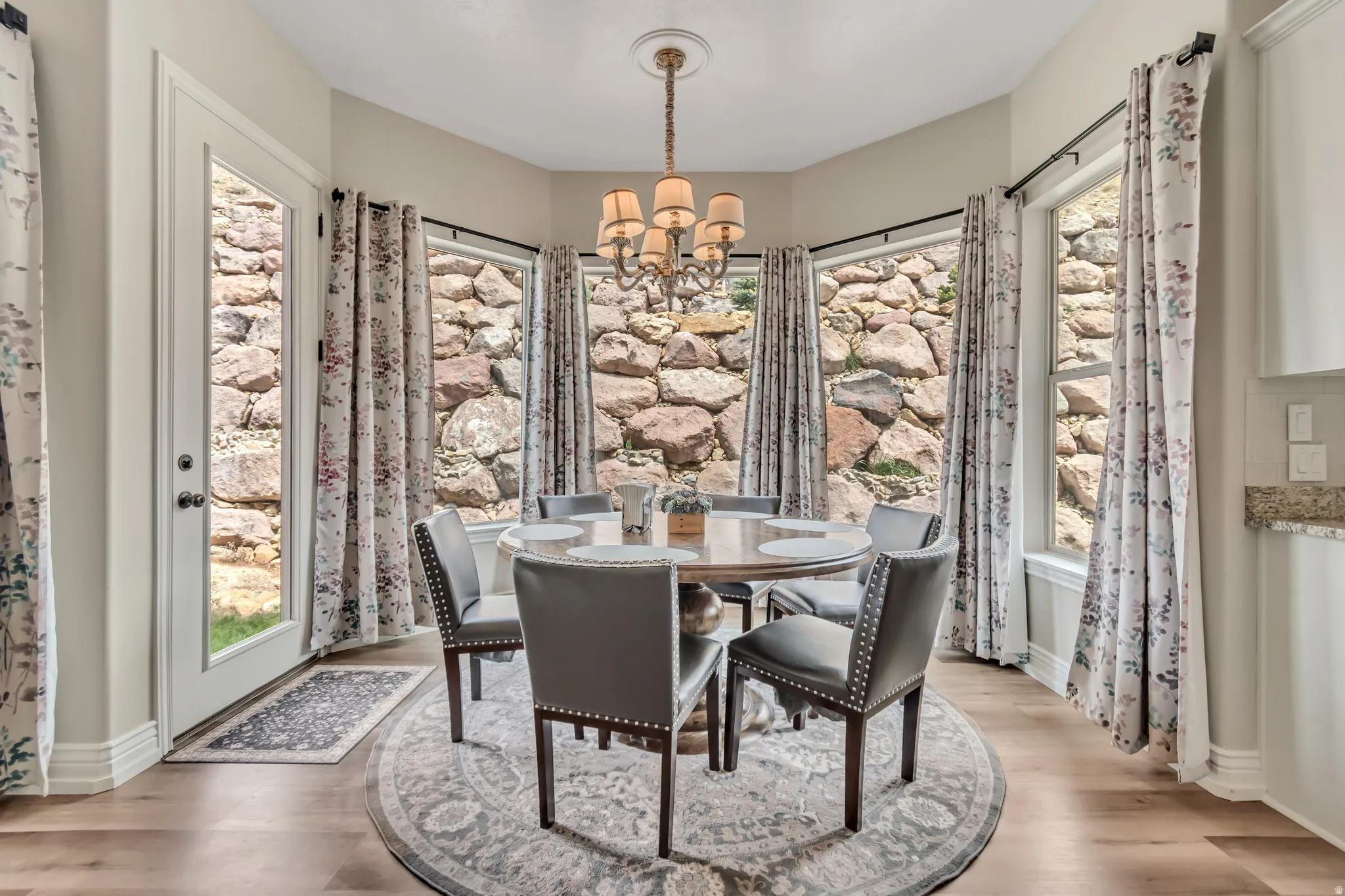Dining area with a chandelier and light wood-style flooring