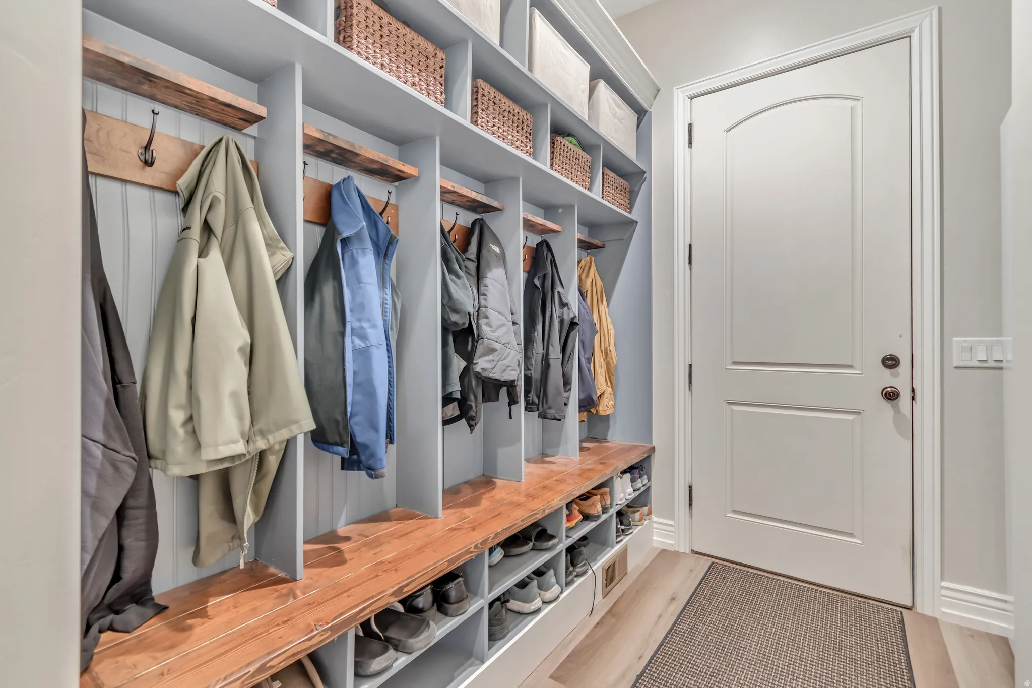 Mudroom with light wood finished floors
