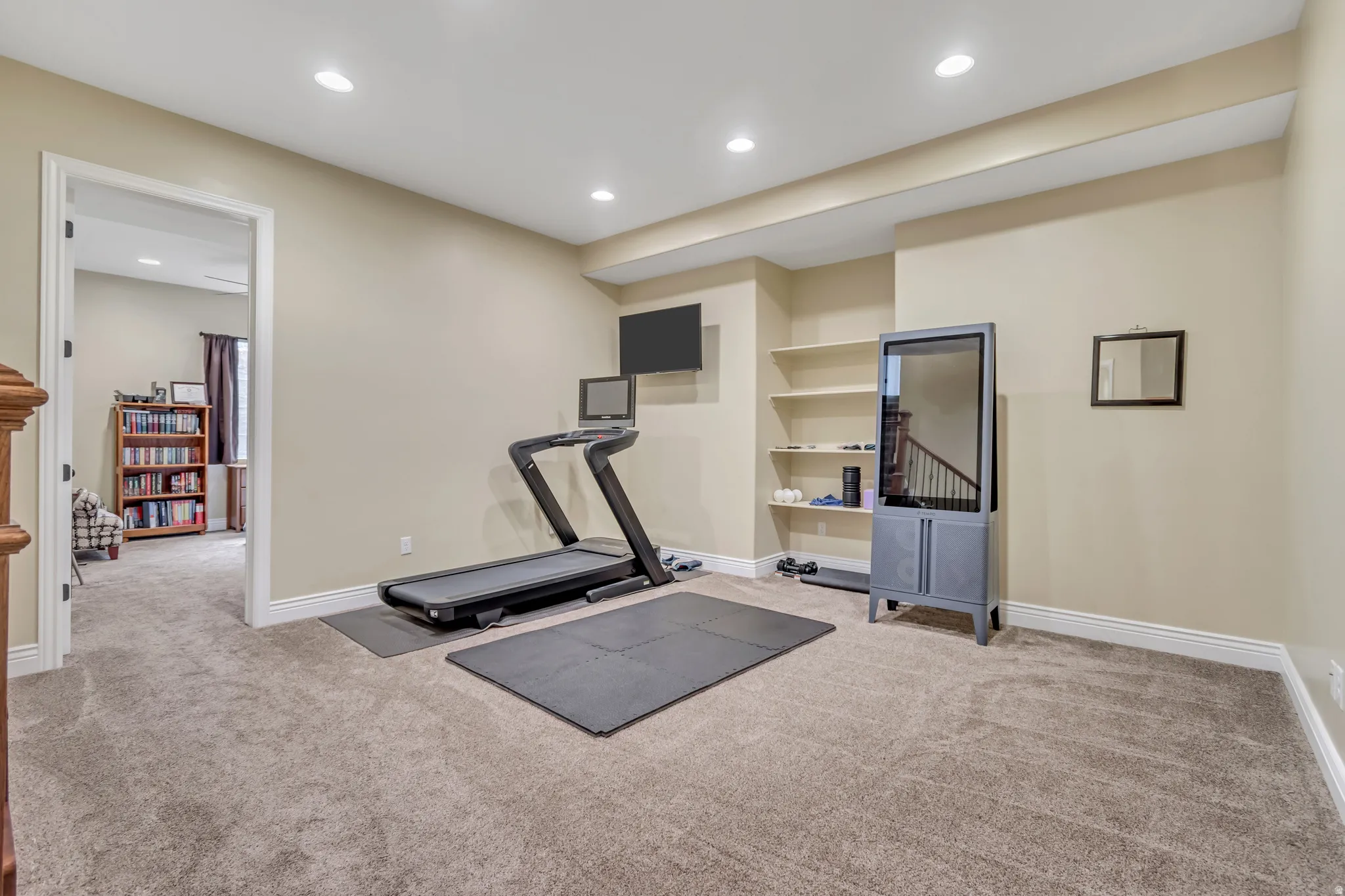 Exercise area with carpet and recessed lighting