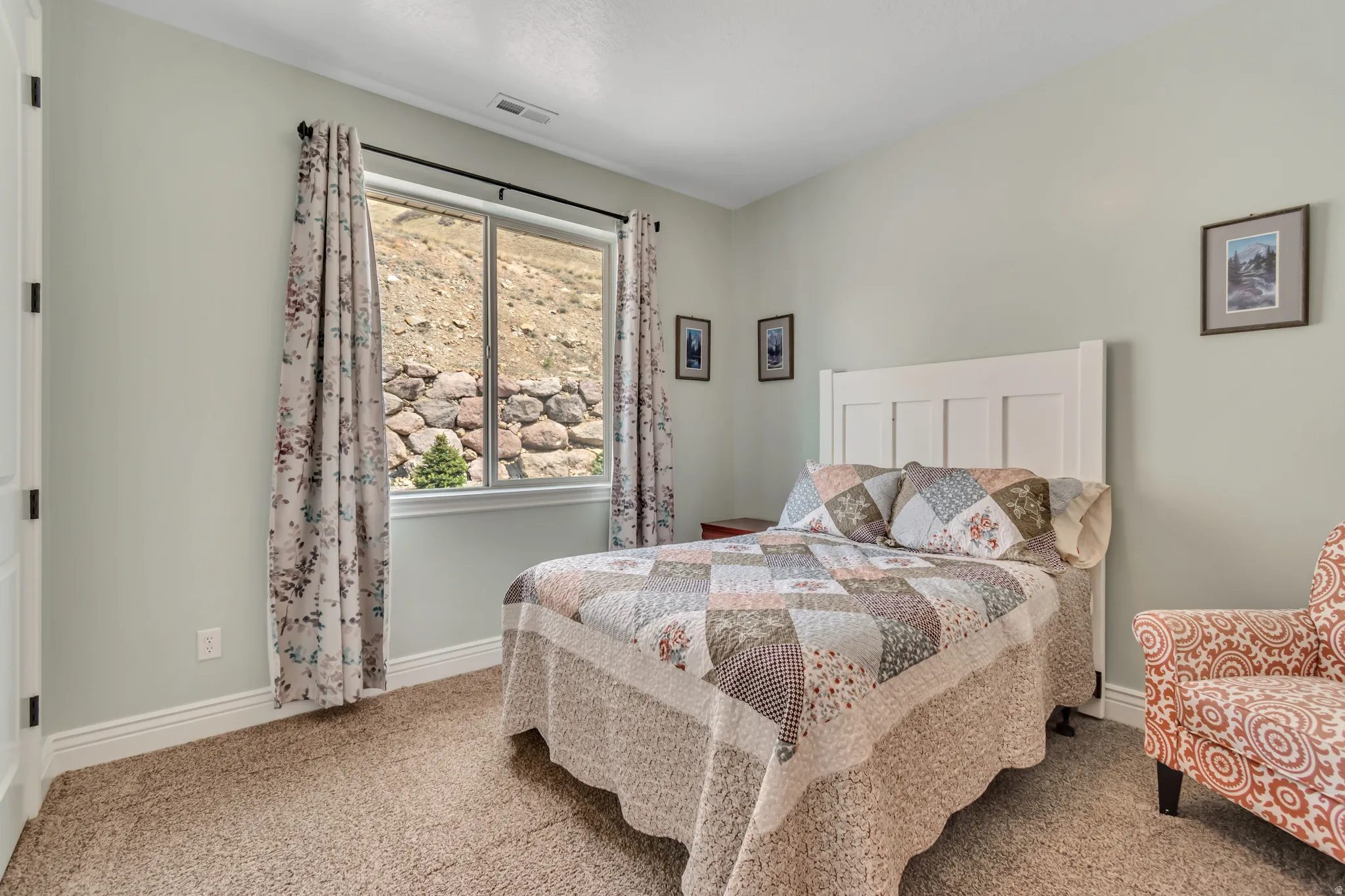 Carpeted bedroom featuring baseboards