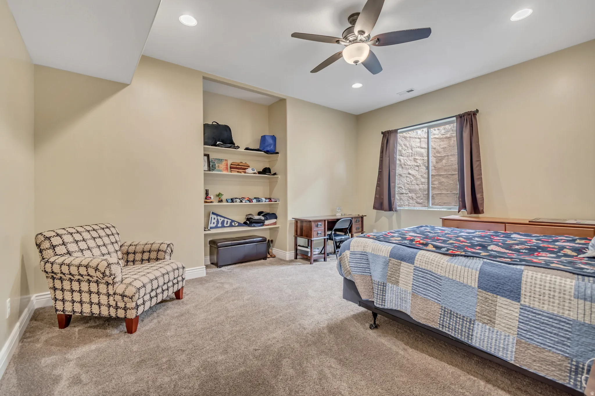 Bedroom with light carpet, ceiling fan, and recessed lighting