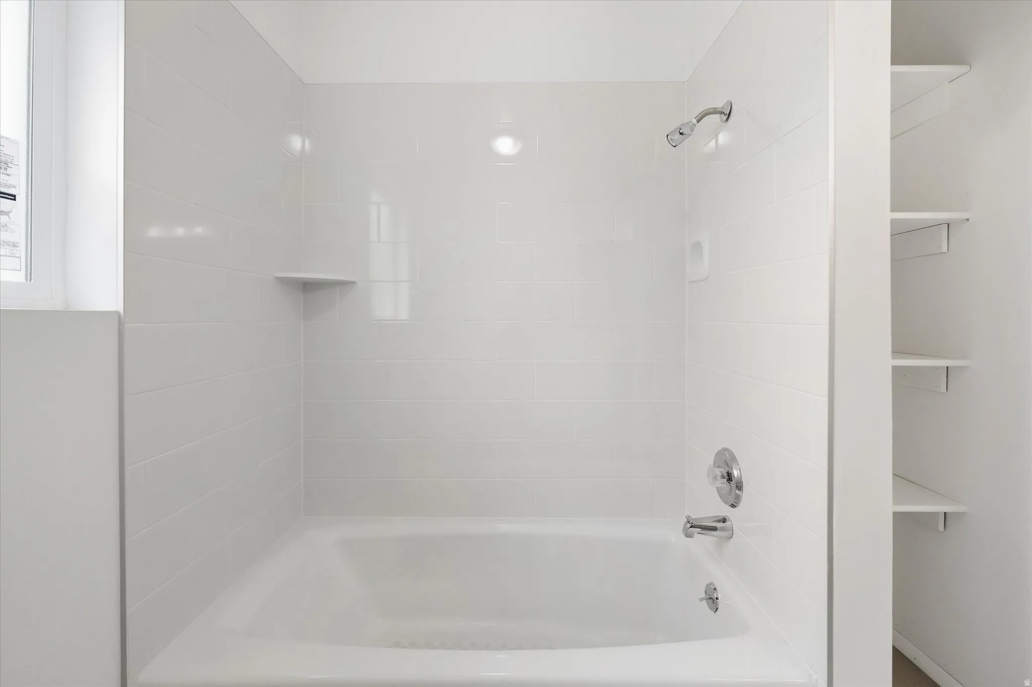 Full bath featuring shower / washtub combination