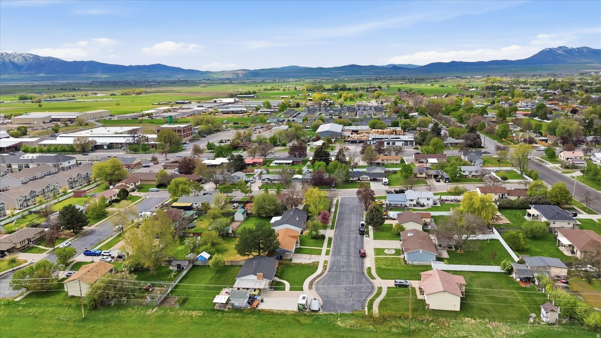 Aerial perspective of suburban area featuring a mountain backdrop