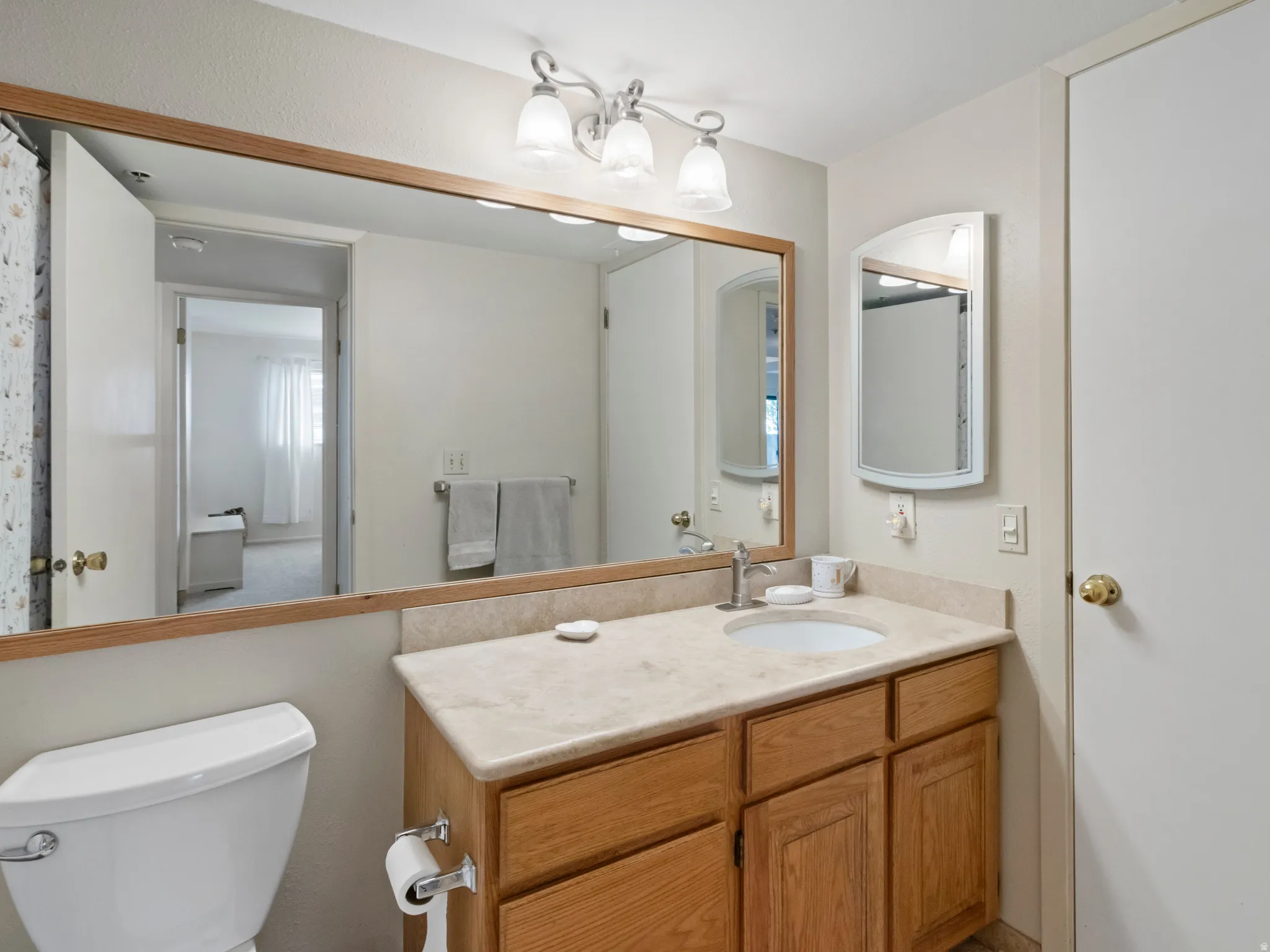 Bathroom featuring toilet and vanity
